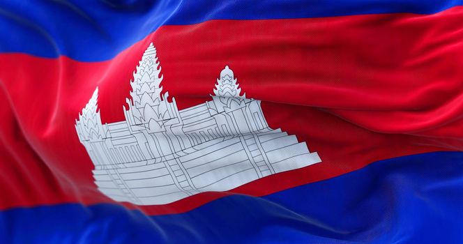 Close-up view of the Cambodia national flag waving in the wind. The Kingdom of Cambodia is a country in the Southeast Asia. Fabric textured background. Selective focus
