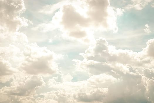 Abstract nature background with clouds in light tonality. White cumulus clouds