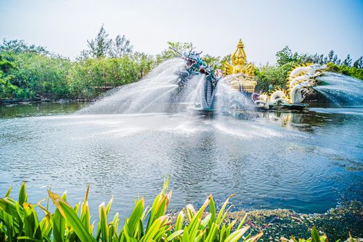 China God Statue Fountain. God Fountain Cement Artwork Statuary in pond landscape.