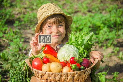 Child and vegetables on the farm. Selective focus. nature.