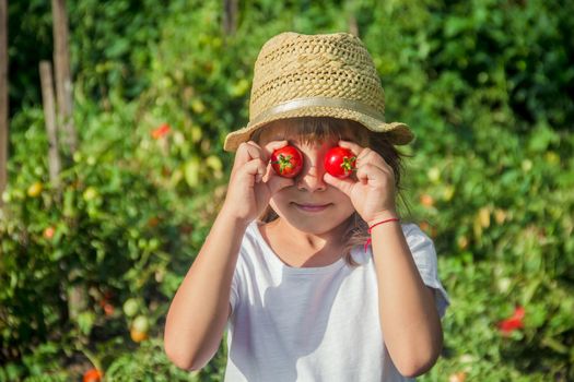 Child and vegetables on the farm. Selective focus. nature.