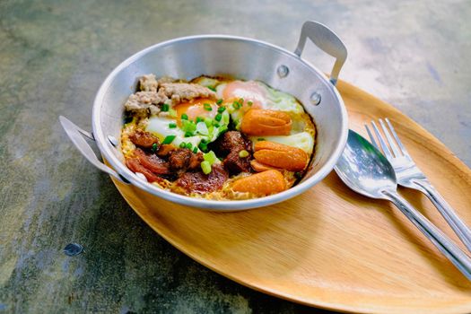 fried egg with tomato bacon in pan breakfast morning business food still life