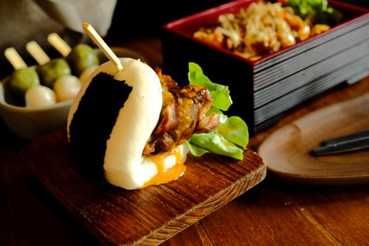 Hirata buns.  Japanese steamed buns filled with pork chashu, tempura, karaage. Japanese traditional food