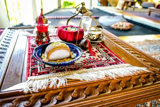 Turkish coffee and tea set in colorful traditional housewares with ice cream in Turkish theme coffee cafe