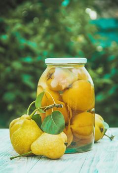 Preserved house pears in jars. Selective focus. food