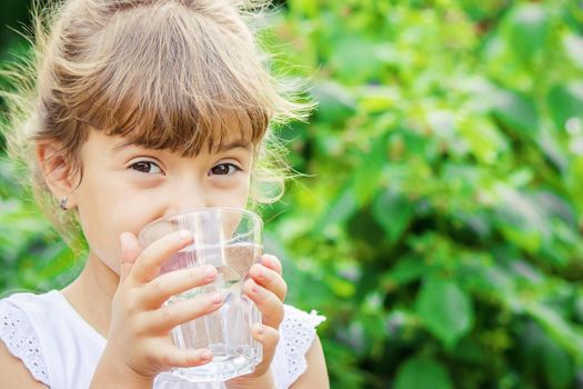 child glass of water. selective focus. Children