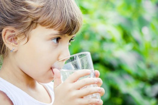 child glass of water. selective focus. Children