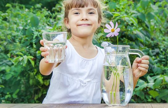 child glass of water. selective focus. food and drink. nature