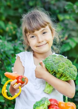 child eats vegetables. Summer photo. Selective focus nature