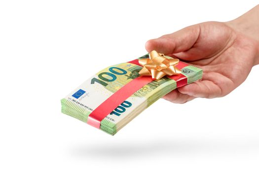 Gift of money. A pack of 100 euro bills in a male hand is isolated on a white background. Money gift concept for birthday or christmas