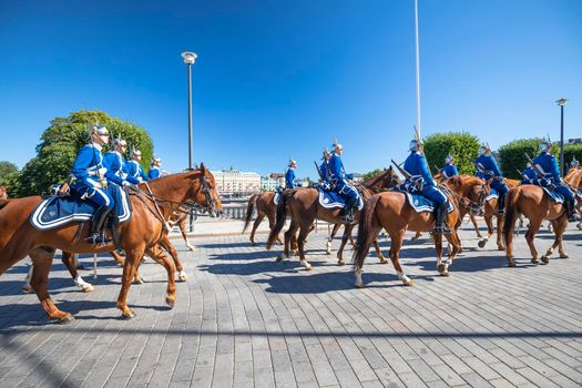 Stockholm, Sweden, August 26 2022: Swedish Royal Mounted Guards cavalry marching through Stockholm street. The Royal Guards units has continuously guarded the Swedish royal family in Stockholm since 1523.

