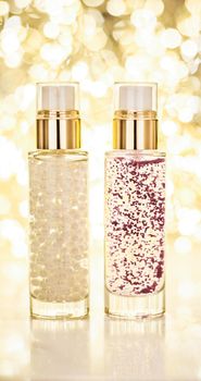 Cosmetic branding, blank label and glamour present concept - Holiday make-up base gel, serum emulsion, lotion bottle and golden glitter, luxury skin and body care cosmetics for beauty brand ads