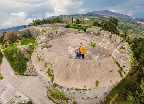 Family on the background barracks in the fortress Spanjola.