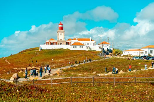Portugal, Sintra, May 2022 View of the Cabo da Roca Lighthouse. Sintra, Portugal. Portuguese Farol de Cabo da Roca is a cape which forms the westernmost point Eurasian land mass. Sunny summer day