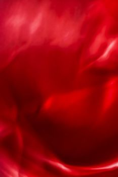 Holiday branding, beauty glamour and love backgrounds concept - Red abstract art background, silk texture and wave lines in motion for classic luxury design