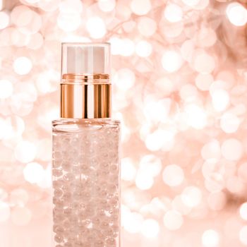 Cosmetic branding, blank label and glamour present concept - Holiday make-up base gel, serum emulsion, lotion bottle and rose gold glitter, luxury skin and body care cosmetics for beauty brand ads