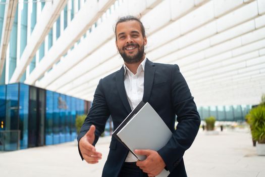 Business. Businessman Giving Hand For Handshake Welcome Gesture Adult Hispanic Male Business Person Holding Document Paper Give Hand Ready Handshake Office Building Background