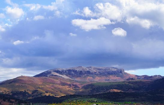 mountain scenery with dramatic sky and storm clouds