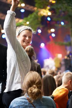 Excitement at the show. young people enjoying an outdoor music festival