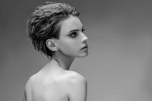 Young woman with naked shoulders, black and white