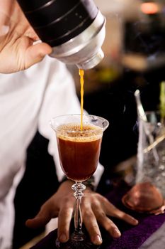 Barman making alcohol coffe drink.Pouring drink