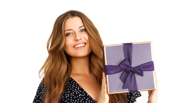 Birthday, Christmas or holiday present, happy woman holding a purple gift or luxury beauty box subscription delivery isolated on white background, portrait