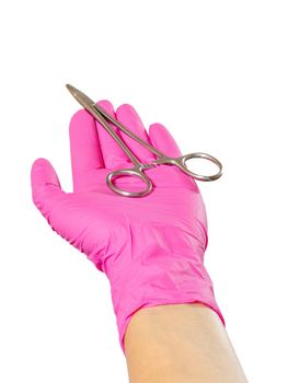 Woman's hand in a latex glove with the stainless steel needle holder on the white isolated background.