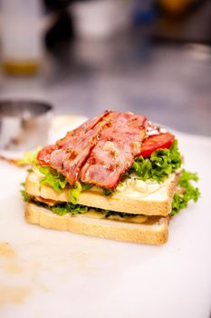 Chef making sandwich with fresh ingredient.Delicious nutrition