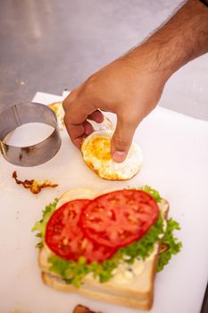 Chef making sandwich with fresh ingredient.Delicious nutrition