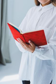Red notebook for business notes. Women's case notebook
