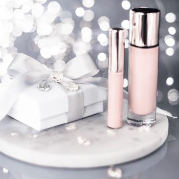 Cosmetic branding, Christmas glitter and girly blog concept - Holiday make-up foundation base, concealer and white gift box, luxury cosmetics present and blank label products for beauty brand design