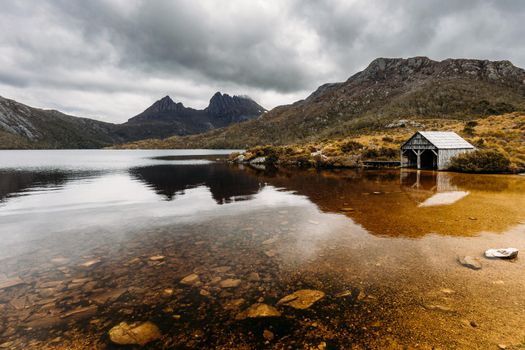 Dove Lake and Cradle Mountain on a cool stormy spring afternoon near sunset in Cradle Mountain, Tasmania, Australia