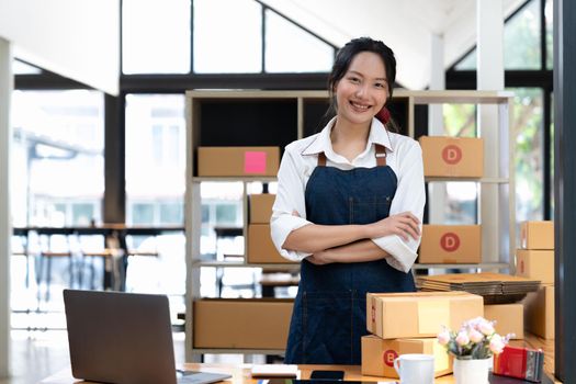 businesswoman start small business and successful SME entrepreneurs A woman works from home delivering parcels online. SME delivery concept and packaging.