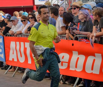 LE MANS, FRANCE - JUNE 11, 2017: Portuguese race car driver Pedro Lamy Aston Martin Racing in the uniform and holding a racing helmet during parade of pilots racing at Le mans,France