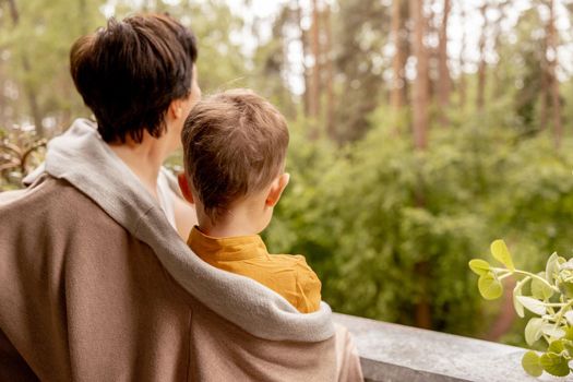 Happy grandmother and grandson enjoy time together. Positive middle age woman spending time with little, cute grandchild, having fun. 50-year-old grandma with grandkid. Multi-generational family