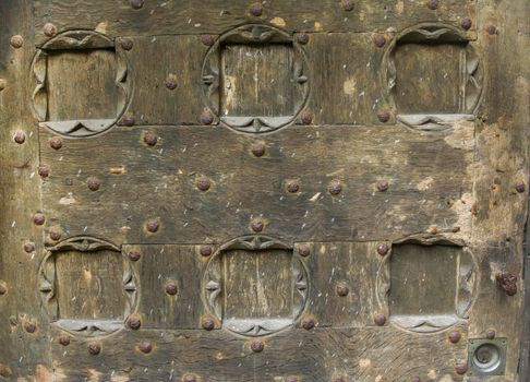 Wooden door with ancient square patten. Wood carving technic.