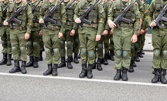 Soldiers in military camouflage uniforms in army formation. Belarusian troops during the parade.