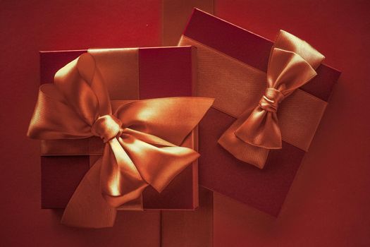 Glamour celebration, wrapped luxe boxes and shopping sale concept - Luxury gifts with golden bow as holiday background, Valentines Day presents surprise