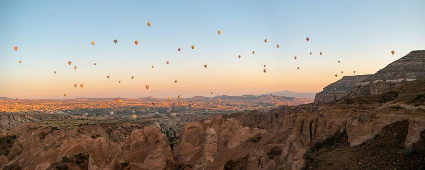 Sunrise with hot air balloons in Cappadocia, Turkey balloons in Cappadocia Goreme Kapadokya, and Sunrise in the mountains of Cappadocia with many hot air ballon in the sky