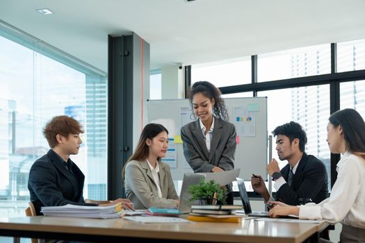 diverse business team people discuss financial result review paperwork share ideas brainstorm collaborate work in teamwork at group briefing table