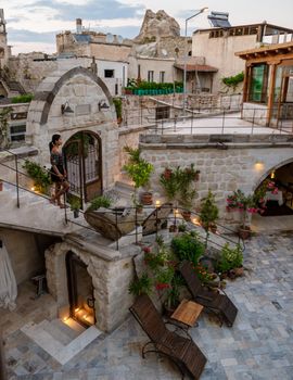 woman in dress at cave house, woman cave house hotel in the mountains of Cappadocia.