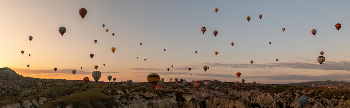 Sunrise with hot air balloons in Cappadocia, Turkey balloons in Cappadocia Goreme Kapadokya, and Sunrise in the mountains of Cappadocia.