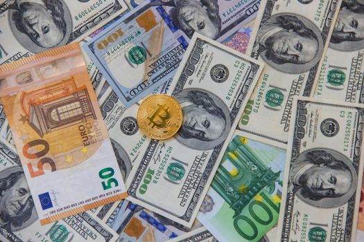 Bitcoin dollars and euro. Selective focus.