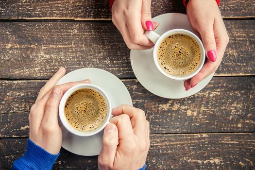 Cup drink for Breakfast in the hands of lovers. Selective focus.