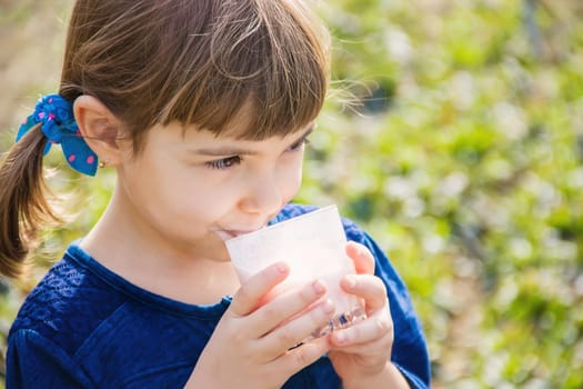 The child drinks milk. Selective focus. Kids.
