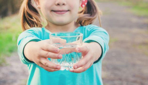 child glass of water. selective focus. Kids.