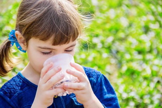 The child drinks milk. Selective focus. Kids.