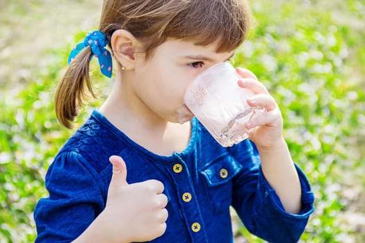 The child drinks milk. Selective focus. Kids.