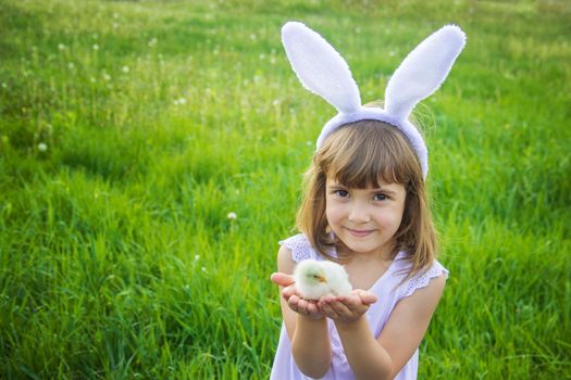 Child with rabbit ears. Easter. Selective focus.