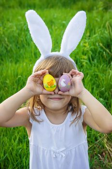 Child with rabbit ears. Easter. Selective focus.